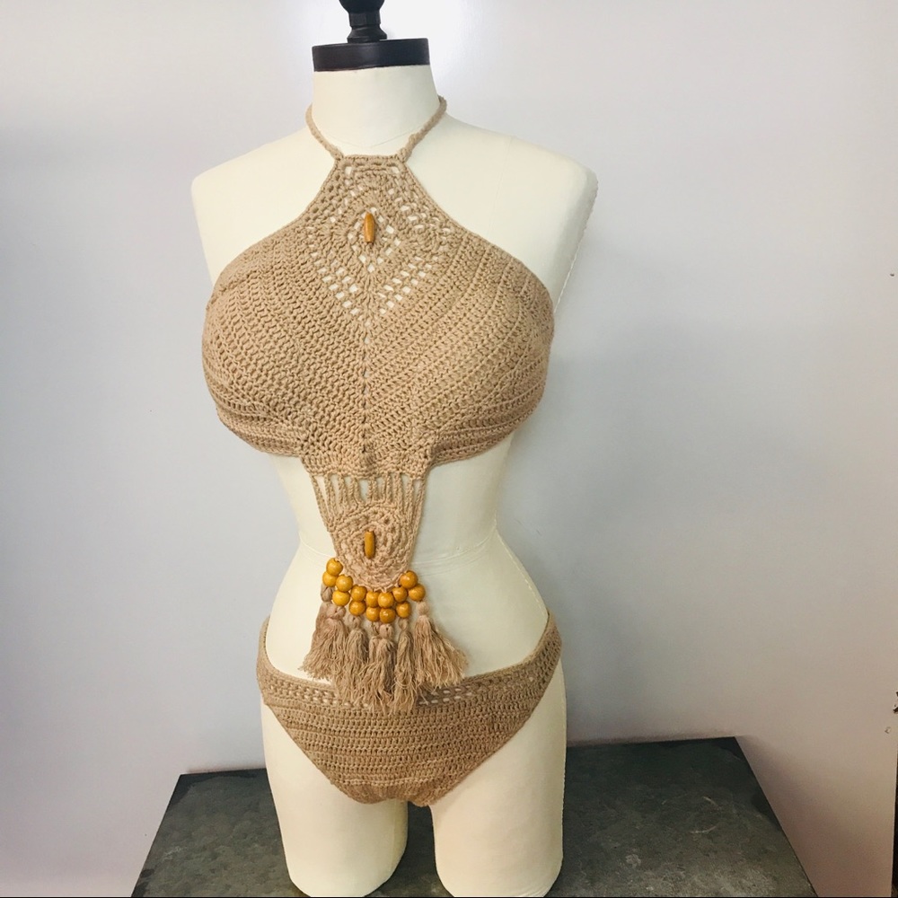 Crochet swimsuit with wood beads.